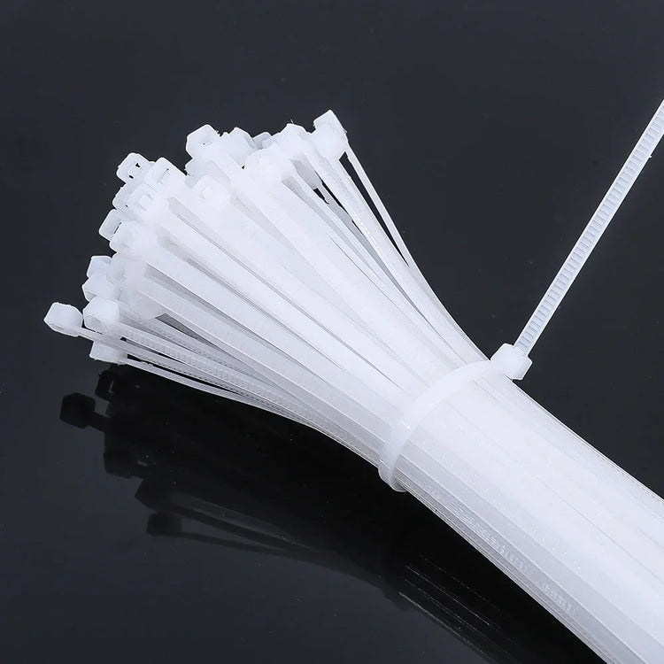 Lot de 100 attaches autobloquantes en nylon, haute résistance jusqu’à 27,2 kg, usage intérieur et extérieur, résistantes aux températures extrêmes, idéales pour organiser câbles, fils, tuyaux, jardin, bricolage, voiture et bureau. Livraison offerte !