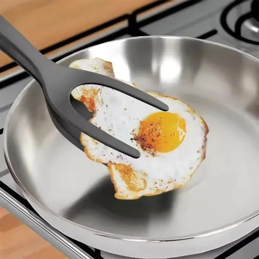 Ingénieuse pince-spatule de cuisine 2 en 1 en nylon résistant à la chaleur 220°C, ustensile multifonction pour œufs, crêpes, steaks, fritures, grillades et poêles antiadhésives. Livraison offerte !